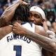 Patrick Beverley and Anthony Edwards of the Minnesota Timberwolves celebrate a 109-104 victory against the Los Angeles Clippers to advance to the NBA Playoffs.